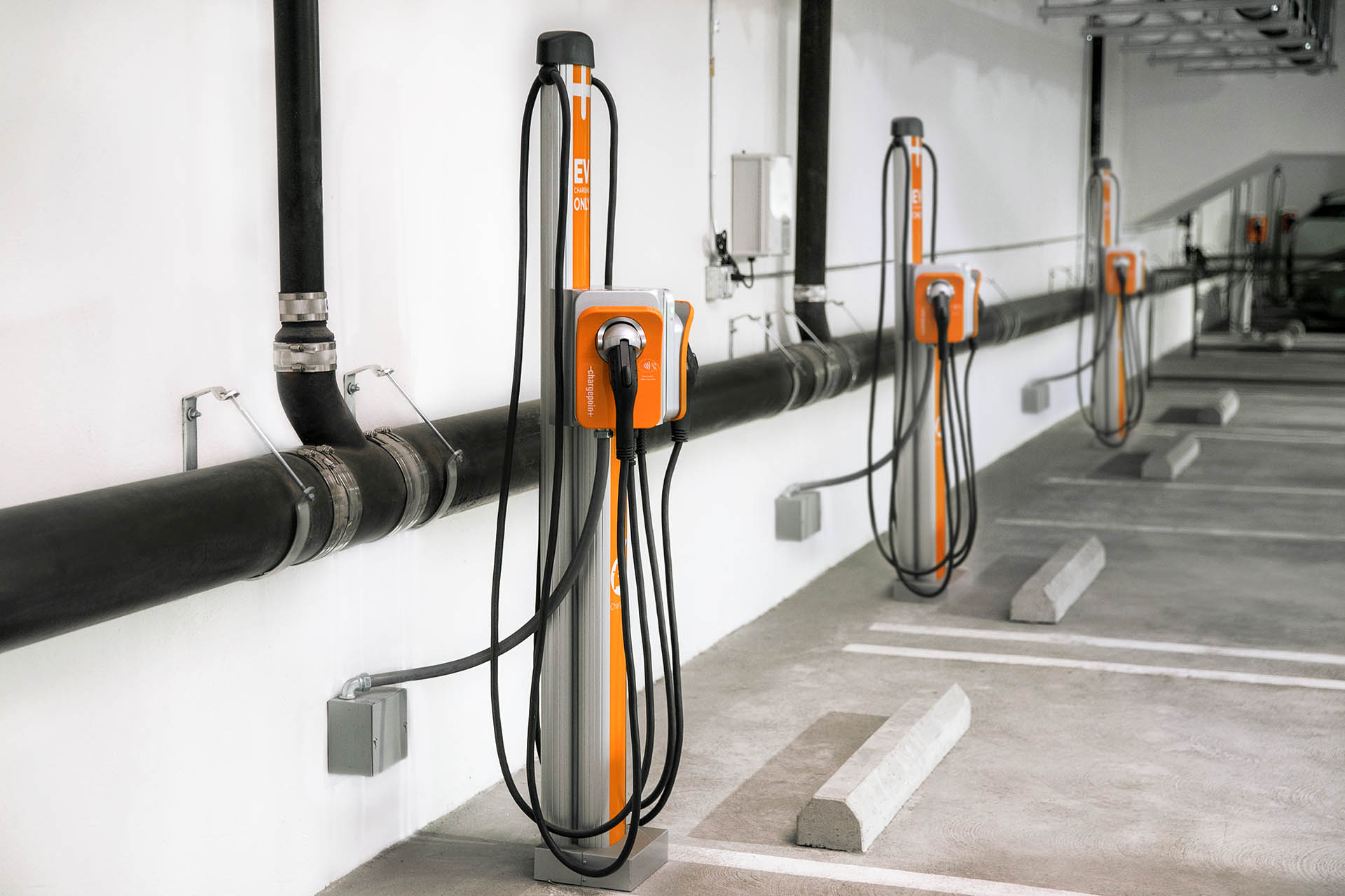 EV charging stations inside of a multifamily residential parking garage